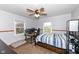 Bedroom with a ceiling fan, natural light and carpeting flooring at 1400 W Cowing Dr, Muncie, IN 47304
