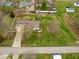 Home with large yard, driveway, back shed, and surrounding fence at 1418 E Maple Dr, Shelbyville, IN 46176