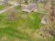 Expansive yard with a storage shed, garden plots, and white picket fence at 1418 E Maple Dr, Shelbyville, IN 46176