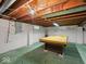 Unfinished basement area with exposed ceiling and pool table at 1418 E Maple Dr, Shelbyville, IN 46176