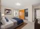 Cozy bedroom featuring a comfortable bed, closet, and carpet at 1418 E Maple Dr, Shelbyville, IN 46176