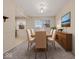 Inviting dining room features a dining table set and natural light at 1418 E Maple Dr, Shelbyville, IN 46176