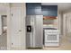 This kitchen features stainless steel appliances, plenty of cabinet storage, and neutral decor at 1418 E Maple Dr, Shelbyville, IN 46176