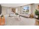 Bright living room featuring stylish furnishings, a large window, and a built-in bookshelf at 1418 E Maple Dr, Shelbyville, IN 46176