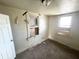 Cozy bedroom features neutral walls, dark carpet, and natural light from two windows at 1437 Kappes St, Indianapolis, IN 46221