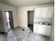 Basic kitchen with dated cabinets and fixtures, ready for renovation at 1437 Kappes St, Indianapolis, IN 46221