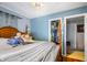 Cozy bedroom with a bed, closet, and doorway at 15 N Fleming St, Indianapolis, IN 46222