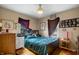 Inviting bedroom with wood floors and a comfortable queen-sized bed at 15 N Fleming St, Indianapolis, IN 46222