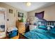 Bedroom featuring wood floors, a queen-sized bed, and a dresser at 15 N Fleming St, Indianapolis, IN 46222