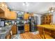 Functional kitchen featuring stainless steel appliances and a breakfast table at 15 N Fleming St, Indianapolis, IN 46222