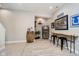 Finished basement with a bar area featuring a wine barrel, mini fridge, and Colts decor at 15638 River Birch Rd, Westfield, IN 46074