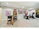 Finished basement featuring a foosball table, exercise equipment, and a home theater setup at 15638 River Birch Rd, Westfield, IN 46074