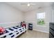 Cozy bedroom features neutral paint, a bright window, and a twin bed at 15638 River Birch Rd, Westfield, IN 46074