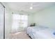 Bright bedroom featuring a ceiling fan, window with curtains, and closet with sliding doors at 15638 River Birch Rd, Westfield, IN 46074