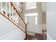 Inviting foyer with hardwood floors, grand staircase, and abundant natural light at 15638 River Birch Rd, Westfield, IN 46074