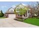 Charming two-story brick home with well-manicured lawn and attached two car garage at 15638 River Birch Rd, Westfield, IN 46074