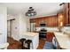 Modern kitchen features stainless steel appliances, center island with seating, and stylish barn door at 15638 River Birch Rd, Westfield, IN 46074