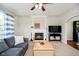 Comfortable living room featuring a fireplace and carpet, next to a large window at 15638 River Birch Rd, Westfield, IN 46074