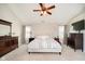 The main bedroom features a ceiling fan, neutral carpet, sitting area and natural light at 15638 River Birch Rd, Westfield, IN 46074