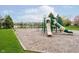 Community playground with slide, swing set, and lake views, great for Gathering fun at 15638 River Birch Rd, Westfield, IN 46074