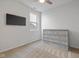 Bedroom with a neutral carpet, a mounted TV and a four-drawer dresser at 17301 Dallington St, Westfield, IN 46074