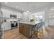 Well-equipped kitchen with stainless steel appliances, a spacious island, and white subway tile backsplash at 17301 Dallington St, Westfield, IN 46074