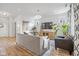 Comfortable living room featuring a large TV, stylish furniture, and light-colored walls and wood-look floors at 17301 Dallington St, Westfield, IN 46074