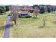 Brick home with a covered porch, detached garage and a private setting at 195 Hess Rd, Martinsville, IN 46151