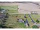 Sprawling acreage with a home, a detached garage, and surrounding lush greenery at 195 Hess Rd, Martinsville, IN 46151