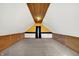 Spacious finished attic with carpet flooring, wood trim, and unique sloped ceilings at 195 Hess Rd, Martinsville, IN 46151