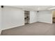 Spacious finished basement featuring carpet, storage niche, and neutral paint at 195 Hess Rd, Martinsville, IN 46151