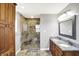 Bathroom featuring a walk-in shower, storage cabinet, and granite double vanity at 195 Hess Rd, Martinsville, IN 46151