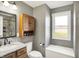 Bathroom with granite countertop vanity and closed wood cabinet at 195 Hess Rd, Martinsville, IN 46151