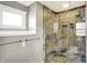 Walk-in shower with stone tile, bench, and modern shower head at 195 Hess Rd, Martinsville, IN 46151