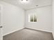 This carpeted room with a window is well-lit by a ceiling light at 195 Hess Rd, Martinsville, IN 46151