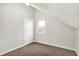 This upper-level bedroom has neutral carpet, white walls, and a dormer window at 195 Hess Rd, Martinsville, IN 46151