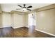 Bedroom with hardwood floors, ceiling fan, and staircase access at 195 Hess Rd, Martinsville, IN 46151