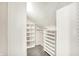 Well-organized walk-in closet featuring custom white shelving and ample storage space at 195 Hess Rd, Martinsville, IN 46151