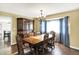 Charming dining room featuring wood furniture, a traditional chandelier, and natural light from large windows at 195 Hess Rd, Martinsville, IN 46151