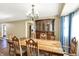 Classic dining room featuring wood furniture, ample natural light, and access to the kitchen and living spaces at 195 Hess Rd, Martinsville, IN 46151