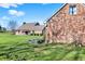 Lovely brick home featuring a spacious green lawn and charming landscaping at 195 Hess Rd, Martinsville, IN 46151