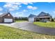 Exterior showcasing beautiful blue siding, brick accents, and an attached garage at 195 Hess Rd, Martinsville, IN 46151