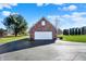 Detached garage, complimented by beautiful landscaping and a pristine driveway at 195 Hess Rd, Martinsville, IN 46151