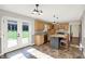 Bright kitchen with a view of the backyard through French doors and kitchen island at 195 Hess Rd, Martinsville, IN 46151