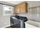 Laundry room with washer, dryer, cabinet and utility sink at 195 Hess Rd, Martinsville, IN 46151