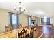 Open-concept living area with seamless flow between dining and living spaces, and natural light from windows at 195 Hess Rd, Martinsville, IN 46151