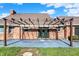 Brick house featuring a paved patio with a pergola draped with shade covers and lighting at 195 Hess Rd, Martinsville, IN 46151