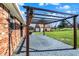 Enjoy this paved patio with pergola and string lights, ideal for outdoor relaxation and entertainment at 195 Hess Rd, Martinsville, IN 46151