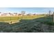 Large backyard with a fenced perimeter and expansive green space with several nearby homes in a quiet residential neighborhood at 198 Rapid Rill Ln, Brownsburg, IN 46112