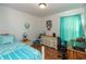 Comfortable bedroom with a bed, dresser, and window with curtains at 198 Rapid Rill Ln, Brownsburg, IN 46112